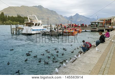 Queenstown New Zealand - March 2016: Queenstown lakefront by Lake Wakatipu New Zealand