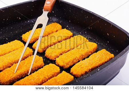 Fish sticks breaded Studio Photo on Pan