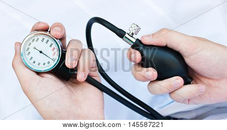 Blood pressure gage in a doctor's hands