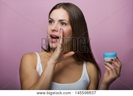 Pretty Woman With A Skin Care Product