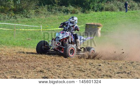 Unidentified Racer Rides A Quad Motorbike.