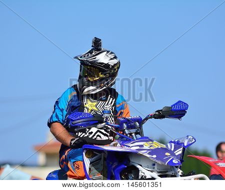 Unidentified Racer Rides A Quad Motorbike.