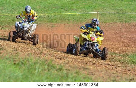 Unidentified Racer Rides A Quad Motorbike.