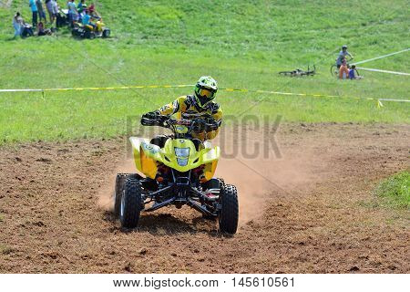 Unidentified Racer Rides A Quad Motorbike.