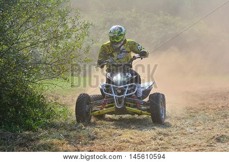 Unidentified Racer Rides A Quad Motorbike.
