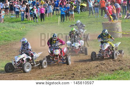 Unidentified Racer Rides A Quad Motorbike.