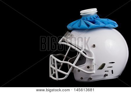 American football white helmet with a ice pack, having a bad season or hurt player.