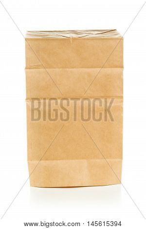 Clean brown paper bag upside down from recycled paper on white background