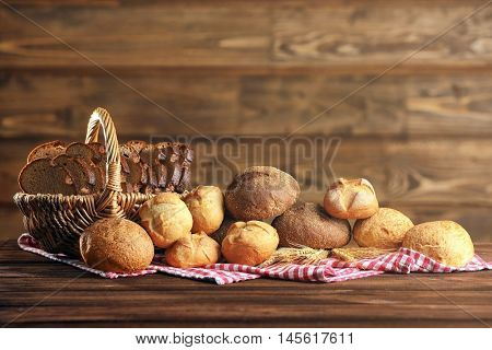 Bread and a variety of fresh bap on a checkered napkin