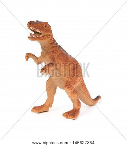 brown plastic dinosaur toy on a white background