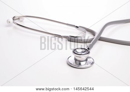 Grey stethscope isolated on white background with lighting