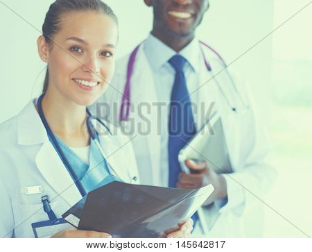 Doctors analyzing an x-ray in a meting