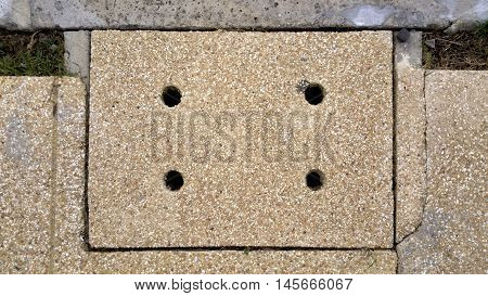 manhole cover of sanitary sewer drainage pipe under footpath