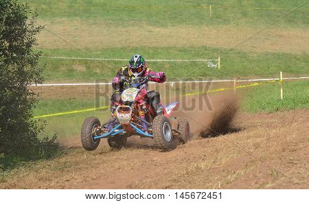 Unidentified Racer Rides A Quad Motorbike.