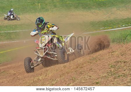 Unidentified Racer Rides A Quad Motorbike.