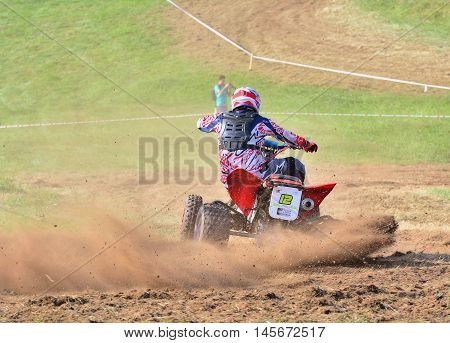 Unidentified Racer Rides A Quad Motorbike.