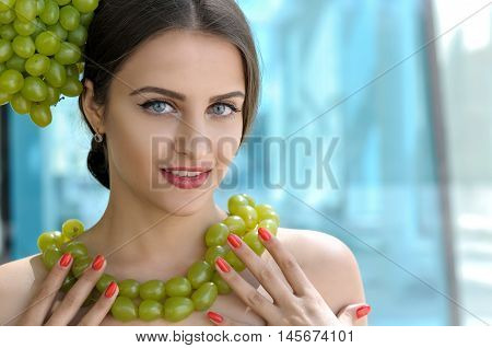 Girl Tries On A Beads From Grapes Like A Necklace