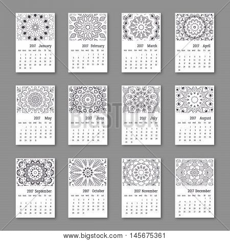 Calendar 2017 start sunday with hand drawn mandala. Vintage oriental style black and white colors. Vector illustration.