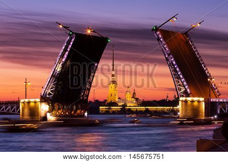 Open Palace Bridge and view of the Peter and Paul Fortress in St.Petersburg in white night
