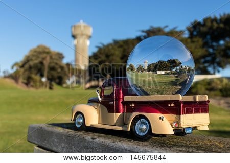 Foxton Old water tower in a glass ball on the back of a truck.