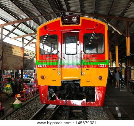 SAMUT SONGKHRAM THAILAND - SEPTEMBER 4 2016 : Mae Klong Market placed all product on railroad all vendors have to move product away when the train passes market.