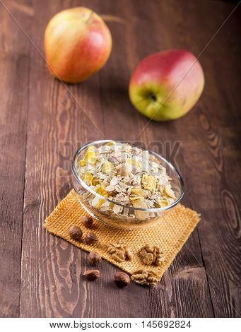 Bowl Of Muesli, Apple, Nuts, Flakes, Candied  For A Nutritious Breakfast With A Low Glycemic Index E