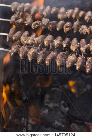 Churrasco, Traditional Brazilian Barbecue, Chicken Hearts Grilled Kebabs.