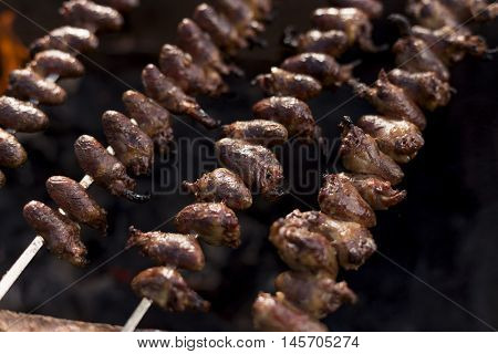 Churrasco, Traditional Brazilian Barbecue, Chicken Hearts Grilled Kebabs.