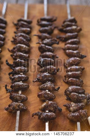 Churrasco, Traditional Brazilian Barbecue, Chicken Hearts Grilled Kebabs.