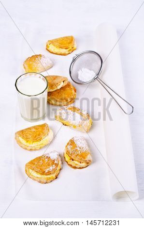 Homemade buns stuffed with cottage cheese on a wooden background. Selective focus.