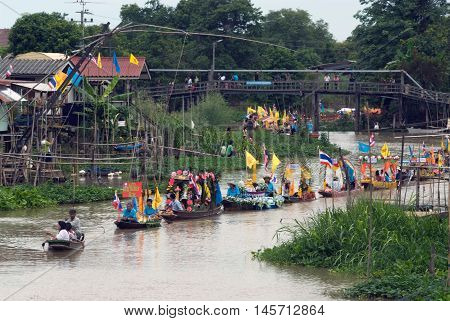 AYUTTHAYA, THAILAND - JULY 15, 2011 : Beautiful flower boats in floating parade, the unique annual Lad Chado candle floating festival of Buddhist lent on July 15, 2011 in Lad Chado canal, Ayutthaya Province, Middle  of  Thailand.