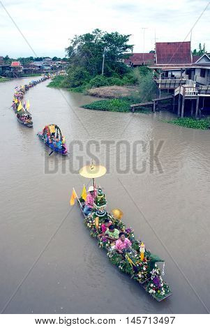 AYUTTHAYA, THAILAND - JULY 15, 2011 : Beautiful flower boats in floating parade, the unique annual Lad Chado candle floating festival of Buddhist lent on July 15, 2011 in Lad Chado canal, Ayutthaya Province, Middle  of  Thailand.