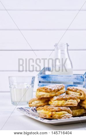 Homemade buns stuffed with cottage cheese on a wooden background. Selective focus.