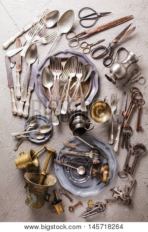 Rarity collectible goods - old cutlery, scissors, keys of different shapes and sizes, old mortar with pestle.