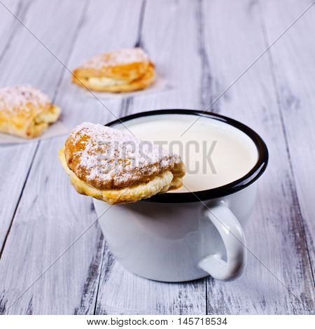 Homemade buns stuffed with cottage cheese on a wooden background. Selective focus.