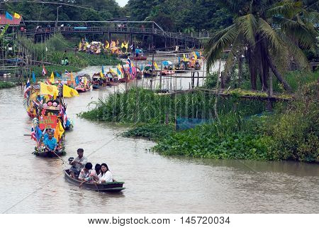 AYUTTHAYA, THAILAND - JULY 15, 2011 : Beautiful flower boats in floating parade, the unique annual Lad Chado candle floating festival of Buddhist lent on July 15, 2011 in Lad Chado canal, Ayutthaya Province, Middle  of  Thailand.