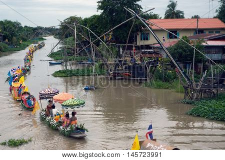 AYUTTHAYA, THAILAND - JULY 15, 2011 : Beautiful flower boats in floating parade, the unique annual Lad Chado candle floating festival of Buddhist lent on July 15, 2011 in Lad Chado canal, Ayutthaya Province, Middle  of  Thailand.