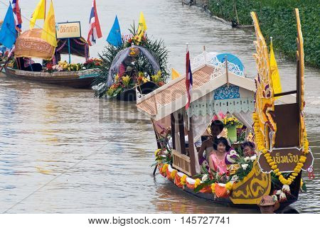 AYUTTHAYA, THAILAND - JULY 15, 2011 : Beautiful flower boats in floating parade, the unique annual Lad Chado candle floating festival of Buddhist lent on July 15, 2011 in Lad Chado canal, Ayutthaya Province, Middle  of  Thailand.