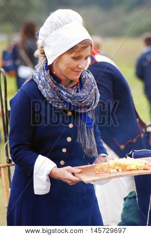 BORODINO MOSCOW REGION - SEPTEMBER 04 2016: Reenactor woman portrait at Borodino battle historical reenactment in Russia. Color photo.