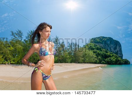 Beautiful woman relexing on the beach. Poda island. Thailand