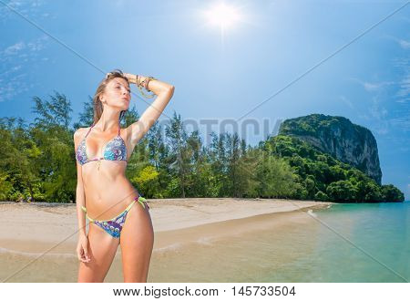Beautiful woman relexing on the beach. Poda island. Thailand
