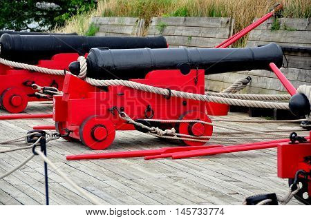 Baltimore Maryland - July 23 2013: 18th century cannons mounted on wooden trolleys at Fort McHenry National Historic Park
