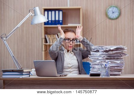 Busy stressful woman secretary under stress in the office