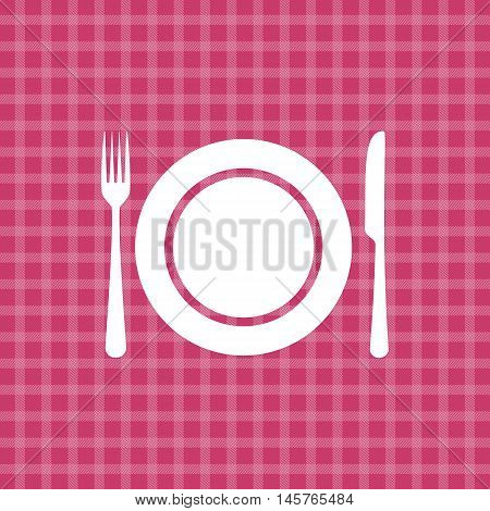 Plate knife and fork on pink picnic checkered tablecloth