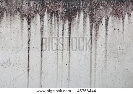 gray concrete wall with black vertical stripes
