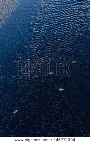 Water flowing down the street after rain