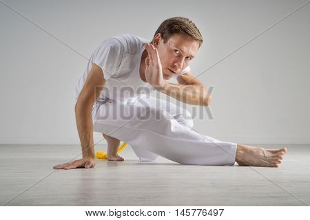 Man practicing capoeira , brazilian martial art.