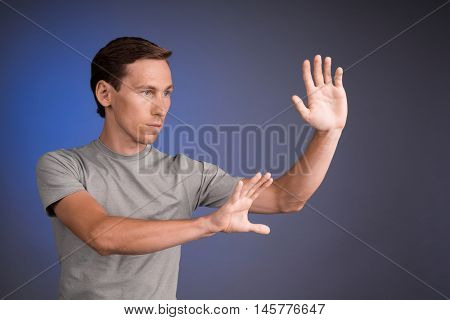 Man working with virtual touch screen.