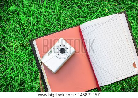 Notebook camera on a the green grass.