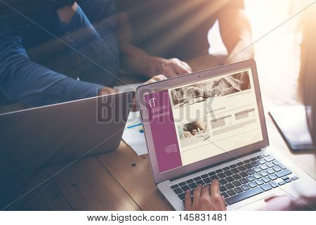 Business Team Brainstorming Process.Coworkers Startup Online Markets.Manager Using Modern Electronic Devices.Creative People Work New IT Project Wood Table.Notebook, Smartphone.Blurred, Flares, Closeup